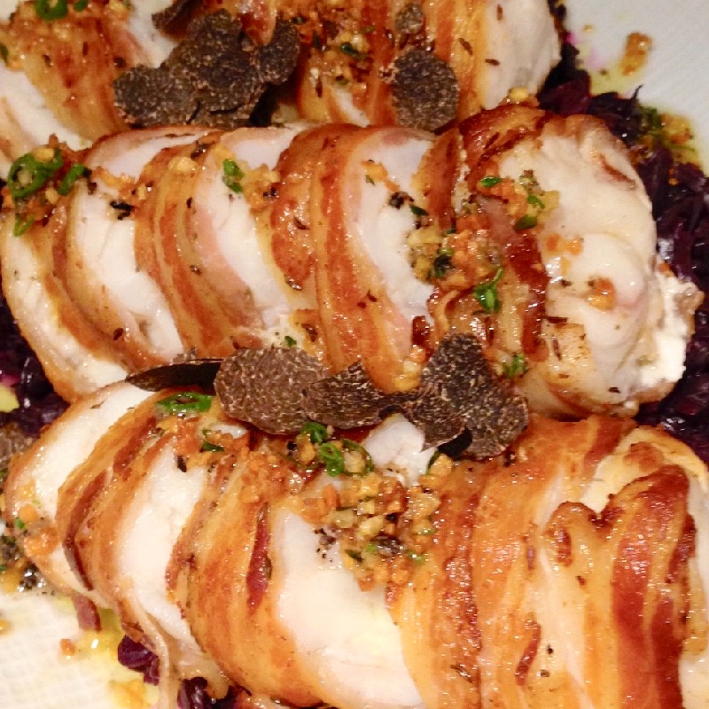 Pancetta wrapped monkfish with braised red cabbage 