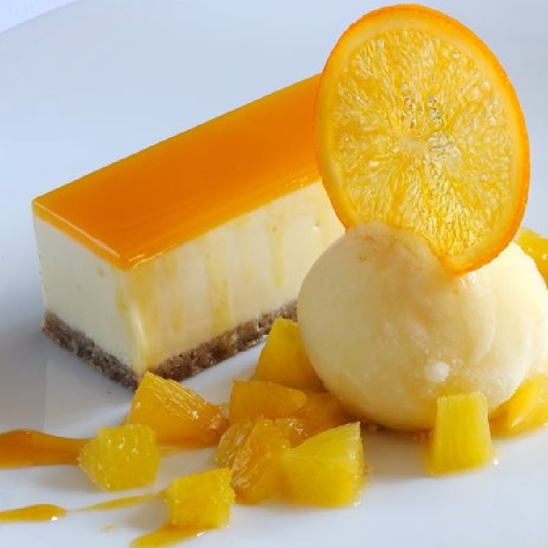  Passion fruit and white chocolate cheesecake with fresh orange sorbet