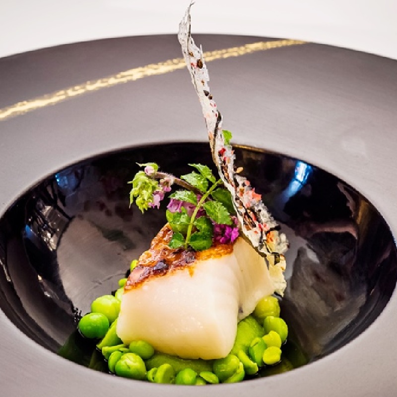 Black cod with petit pois and pea shoots